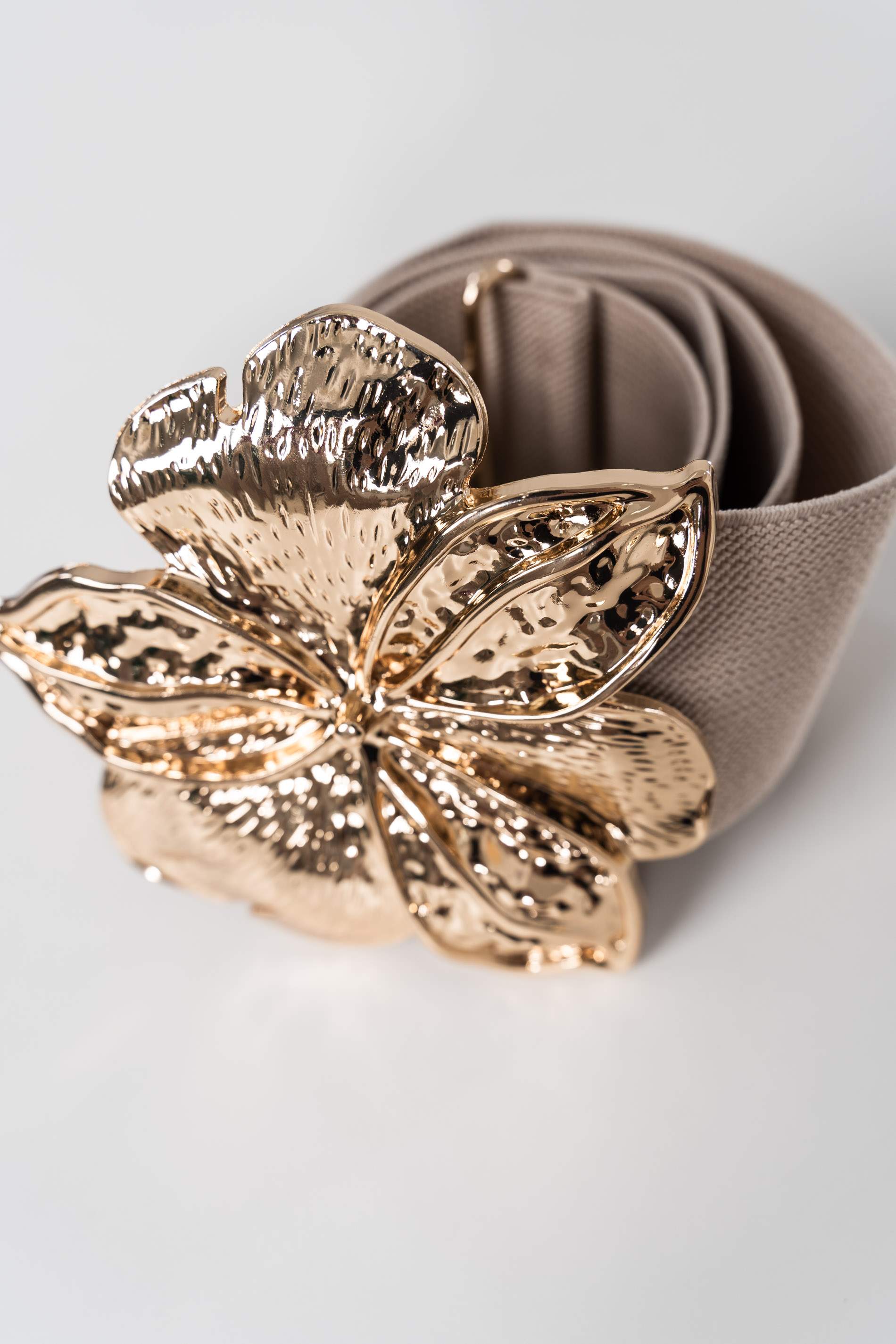CINTURÓN ELÁSTICO FLOR ORO TAUPE