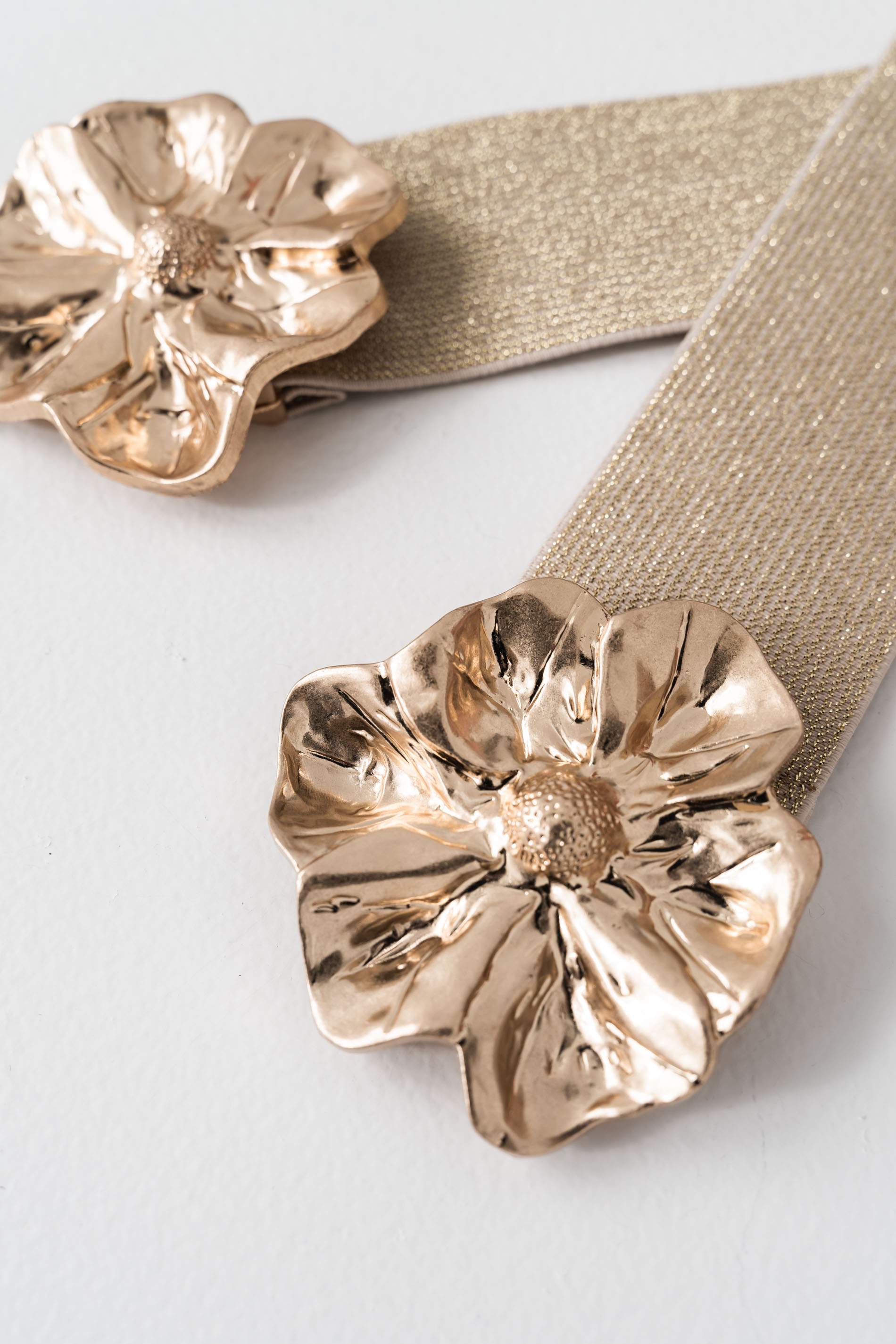 CINTURÓN ELÁSTICO FLOR METAL ORO