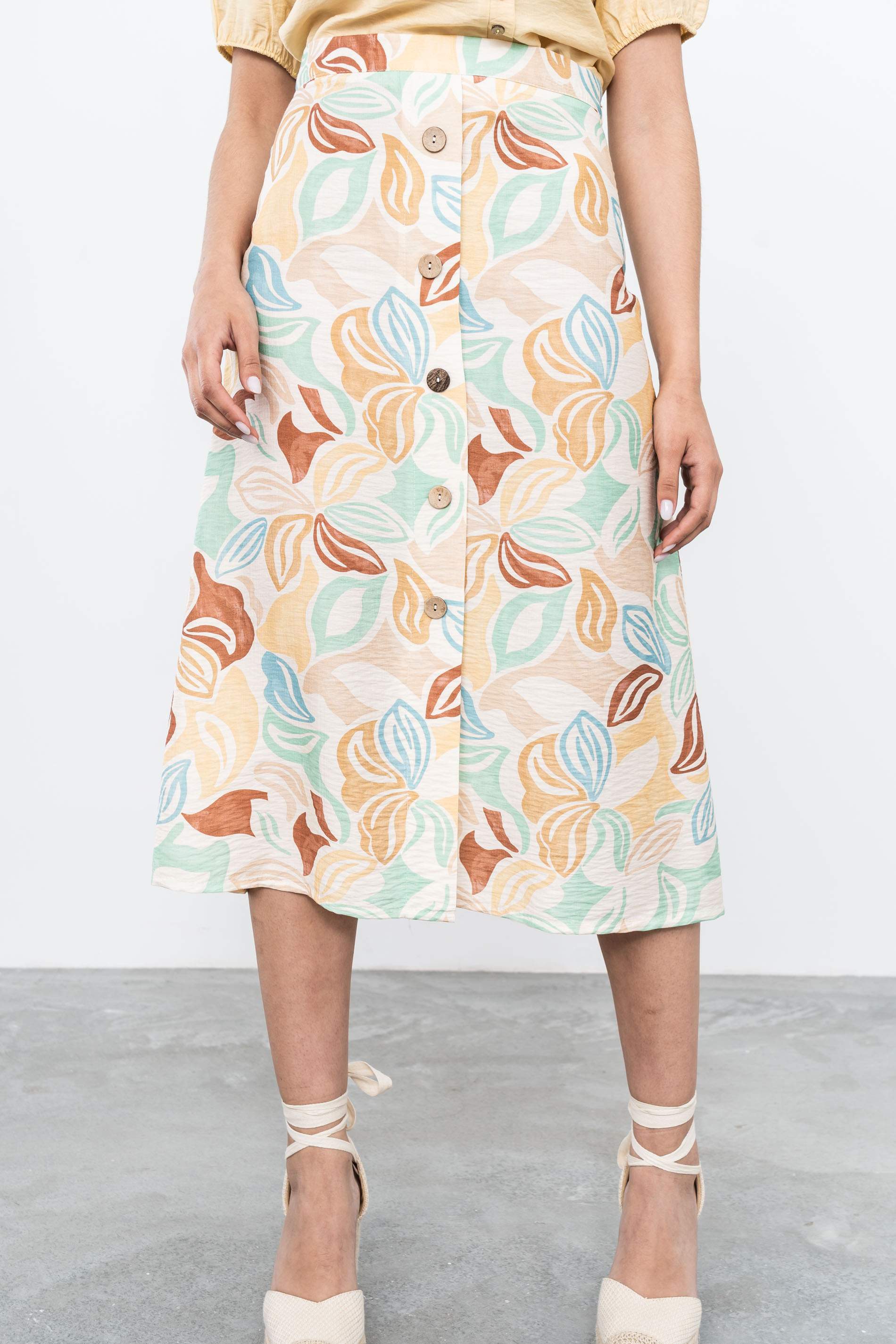 FALDA BOTONES HOJAS COLOR