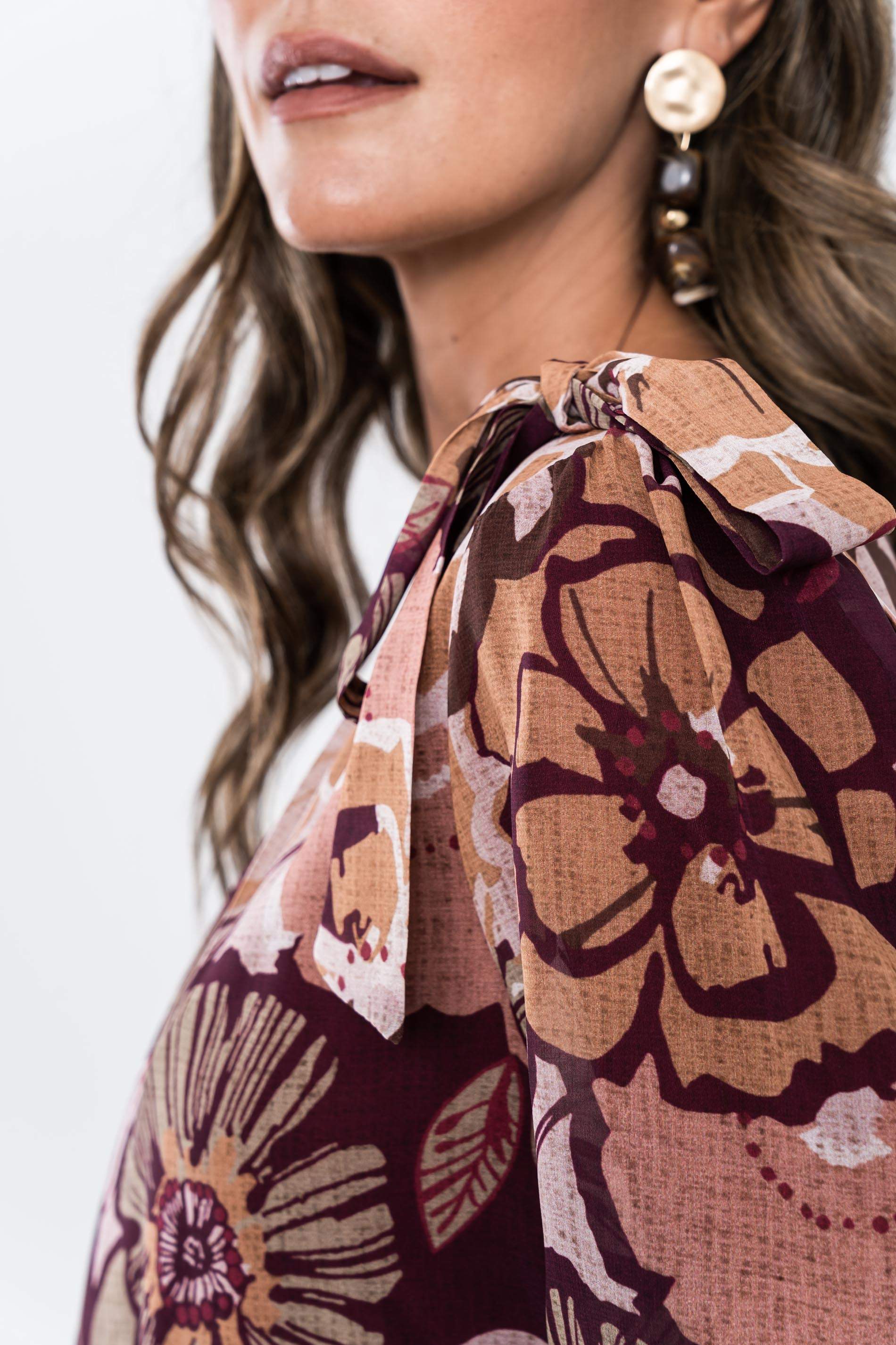 BLUSA ABULLONADA FLORAL