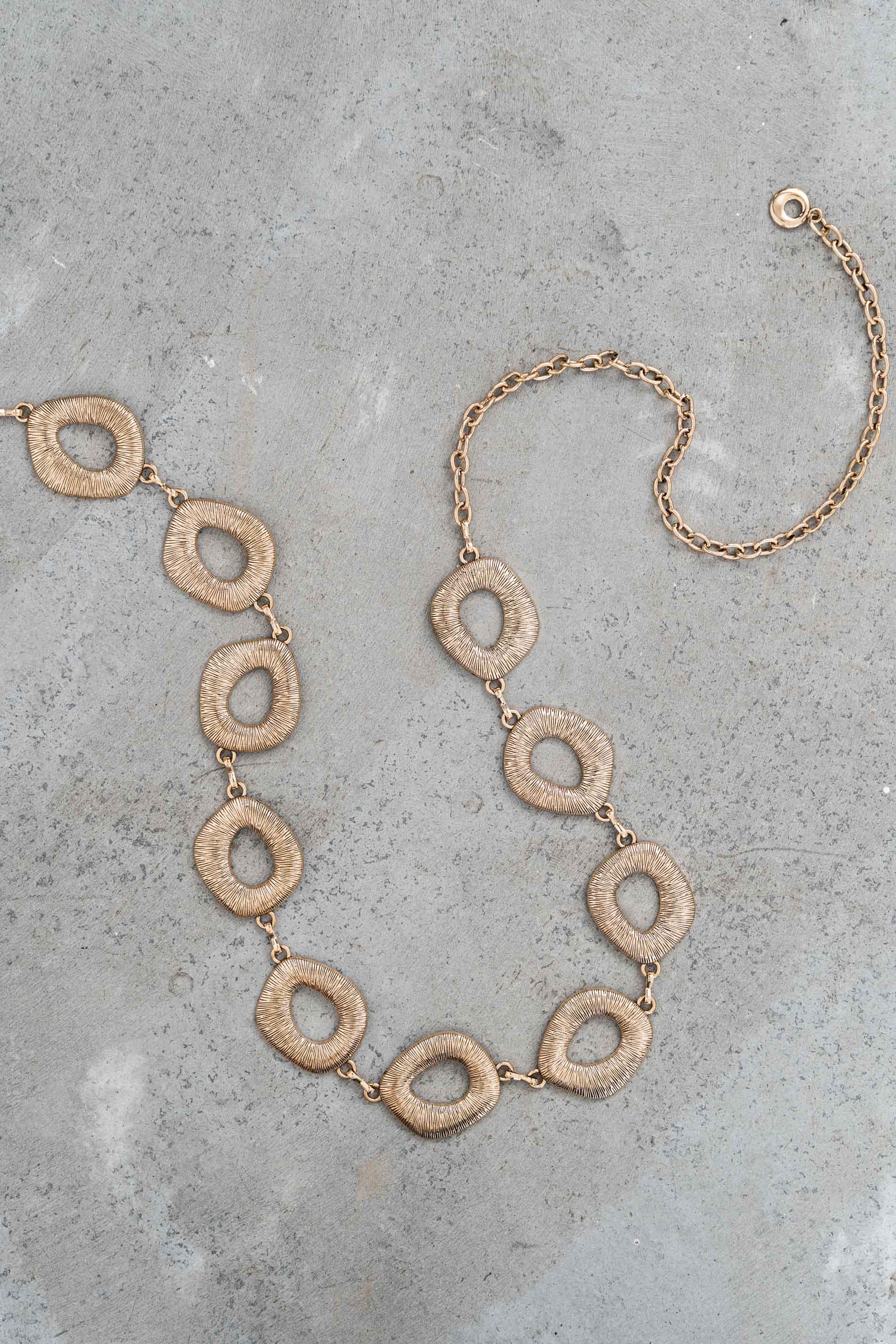 CINTURÓN CADENA OVALADA METALIZADA