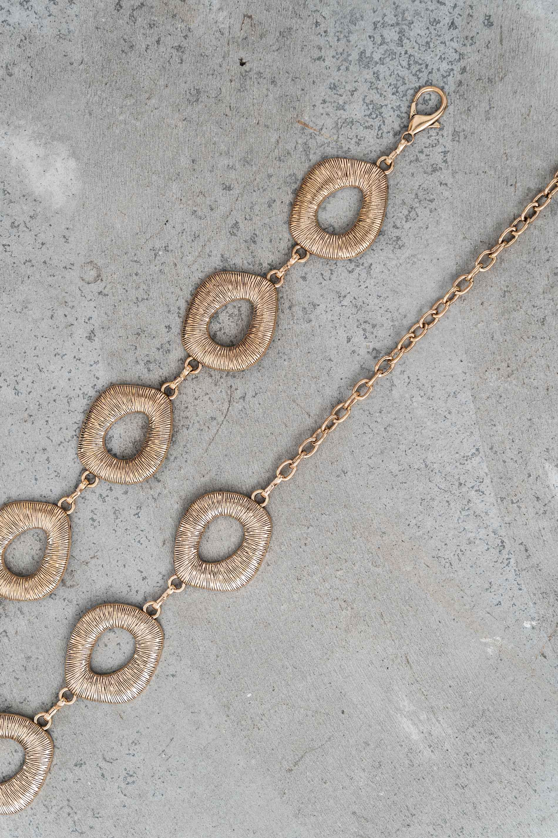 CINTURÓN CADENA OVALADA METALIZADA